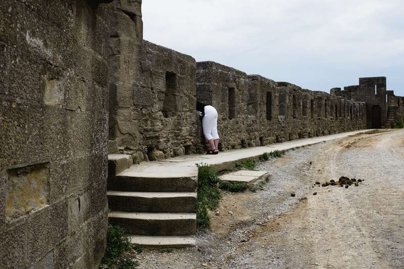 Unyielding Walls: Crenellations and Machicolations in Castles