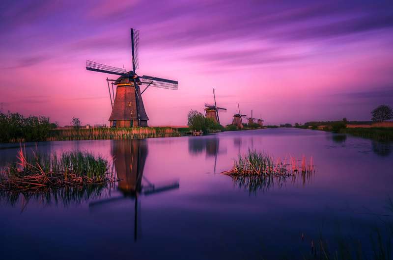 Winter Nights at Kinderdijk: Windmills Under the Stars
