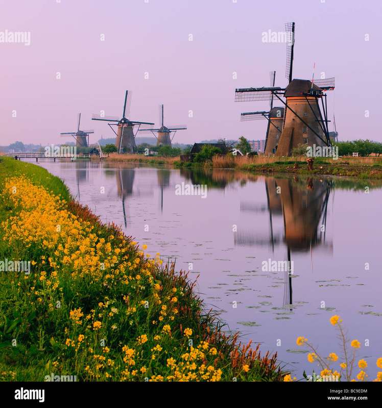 Contrasting Colors: Red Windmill Sails Against Winter Backdrop